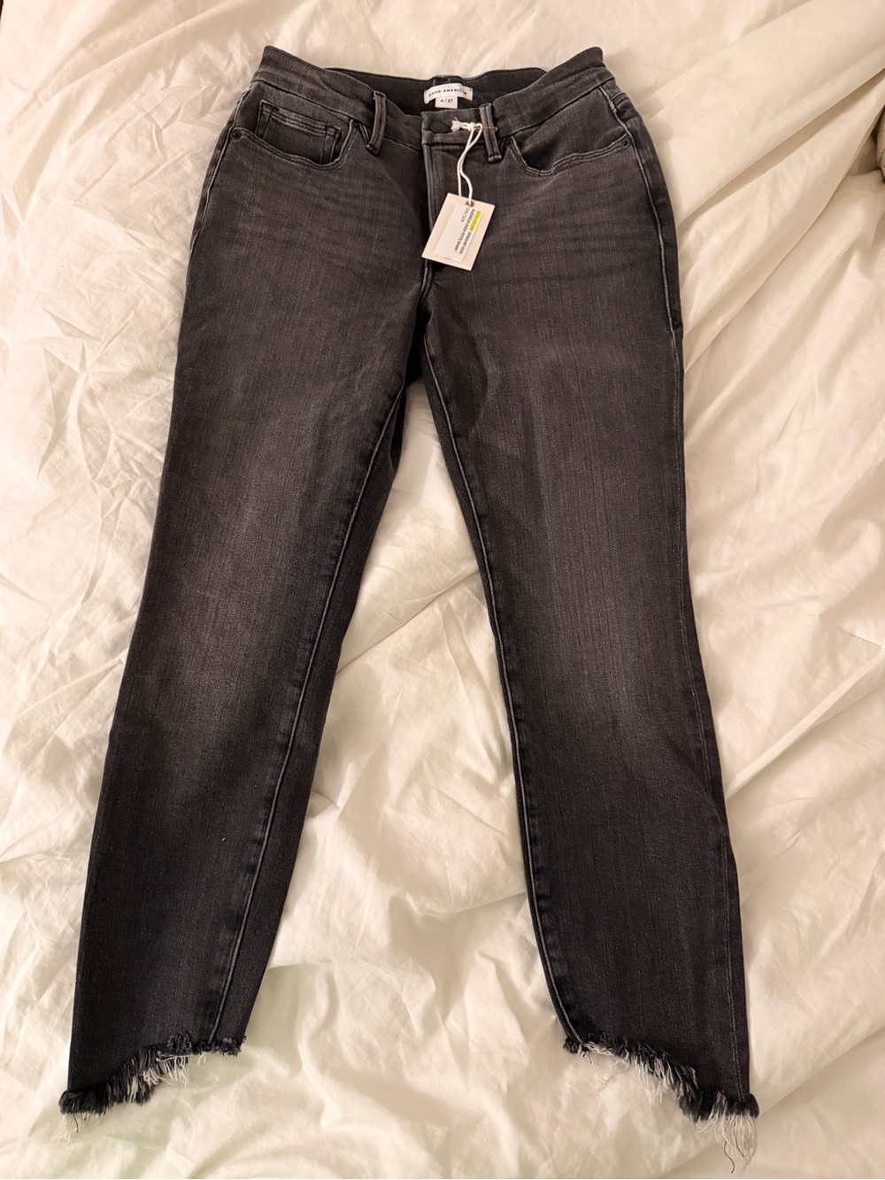 Good American Black Skinny Jeans with Frayed Hem